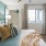 Bedroom with natural lighting and high ceilings