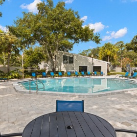 Relax & Unwind Poolside resort style pool with seating