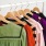 colorful clothes hanging on wooden hangers